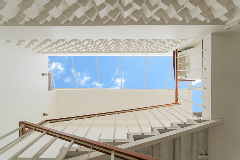 Curved balconies clad in brick tiles define a multi-generational home in Noida