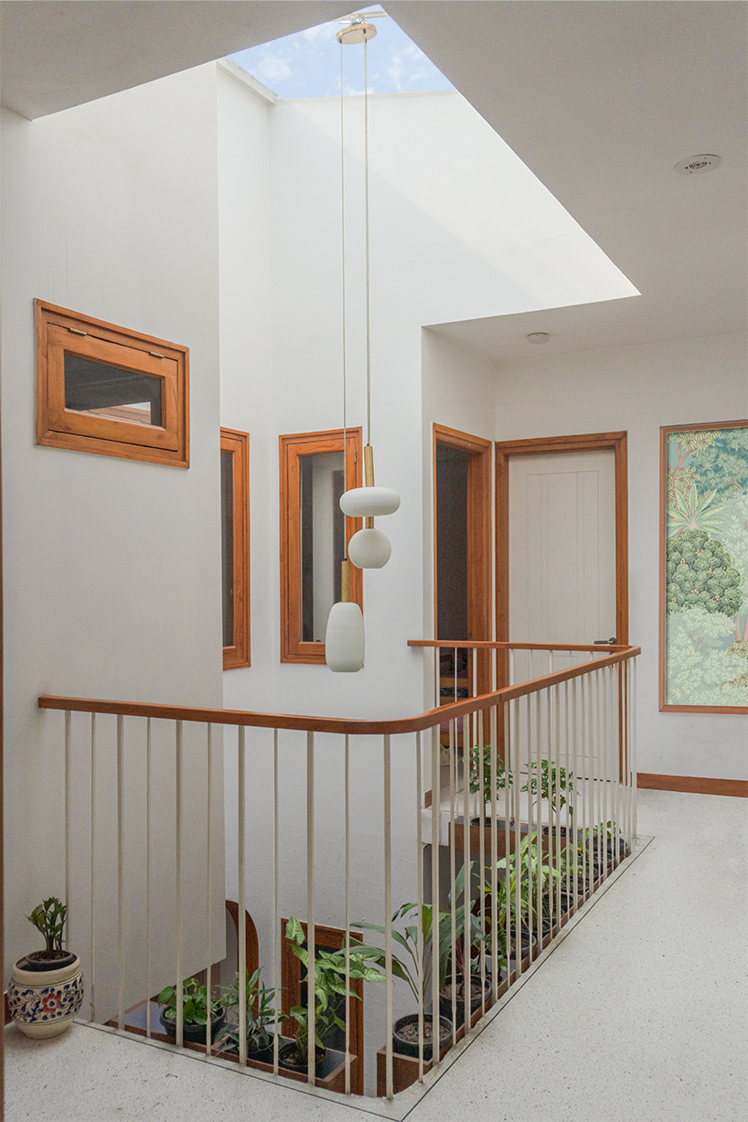 Curved balconies clad in brick tiles define a multi-generational home in Noida
