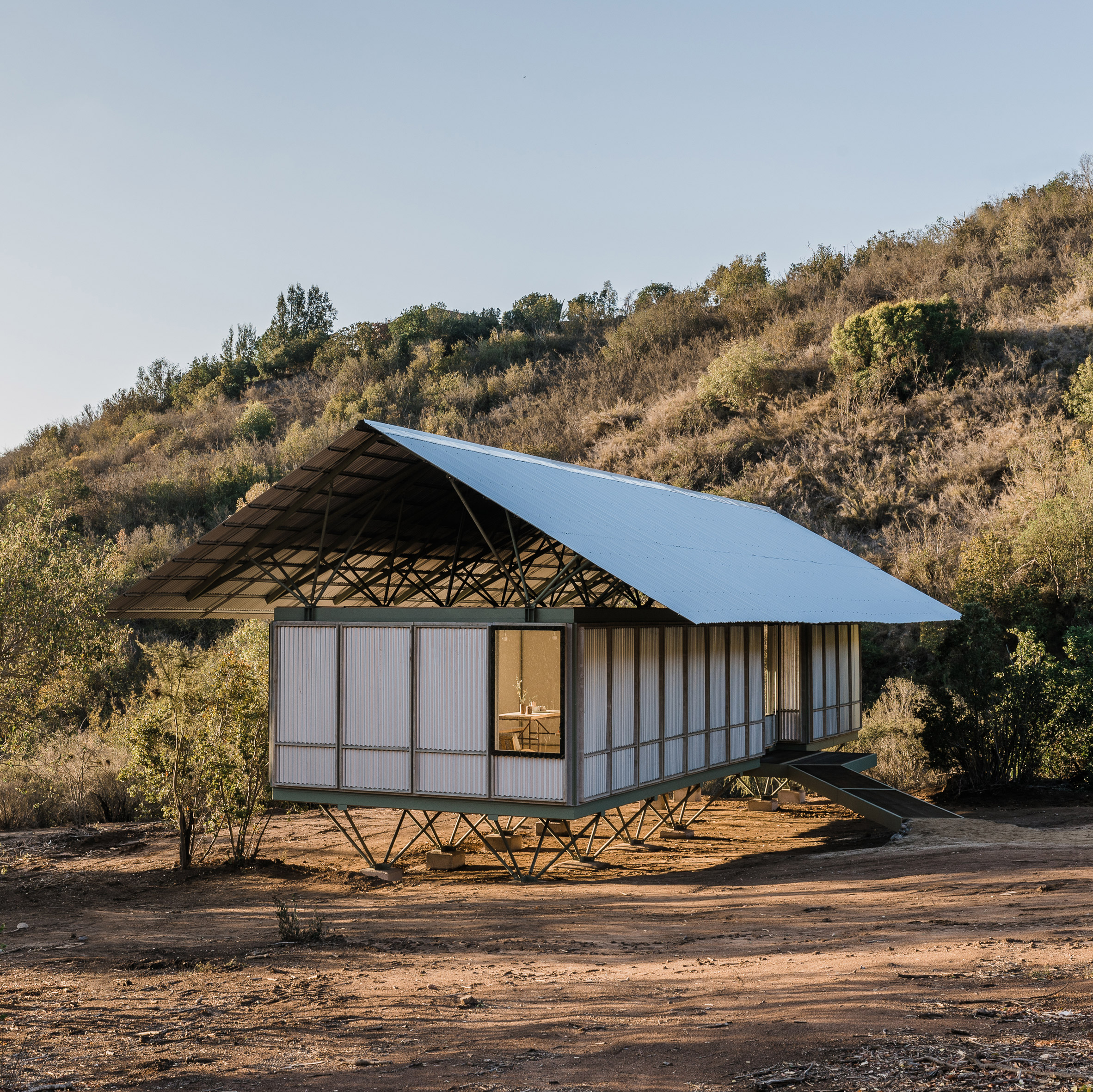 Chilean modular housing prototype uses stilts to traverse difficult site