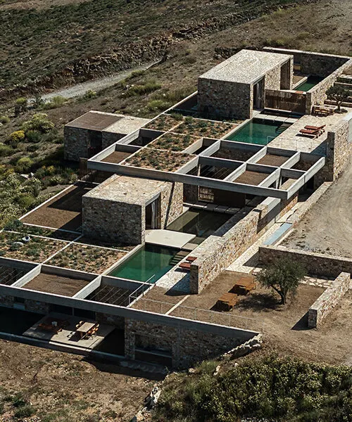 MOLD Architects утопили пять каменных резиденций в скалистом склоне острова Серифос