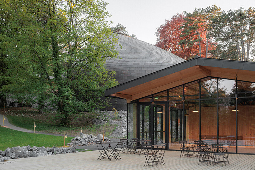 Copper shingles wrap curving concert hall ‘La Source Vive’ in Évian, France