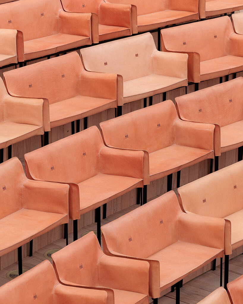 Copper shingles wrap curving concert hall ‘La Source Vive’ in Évian, France