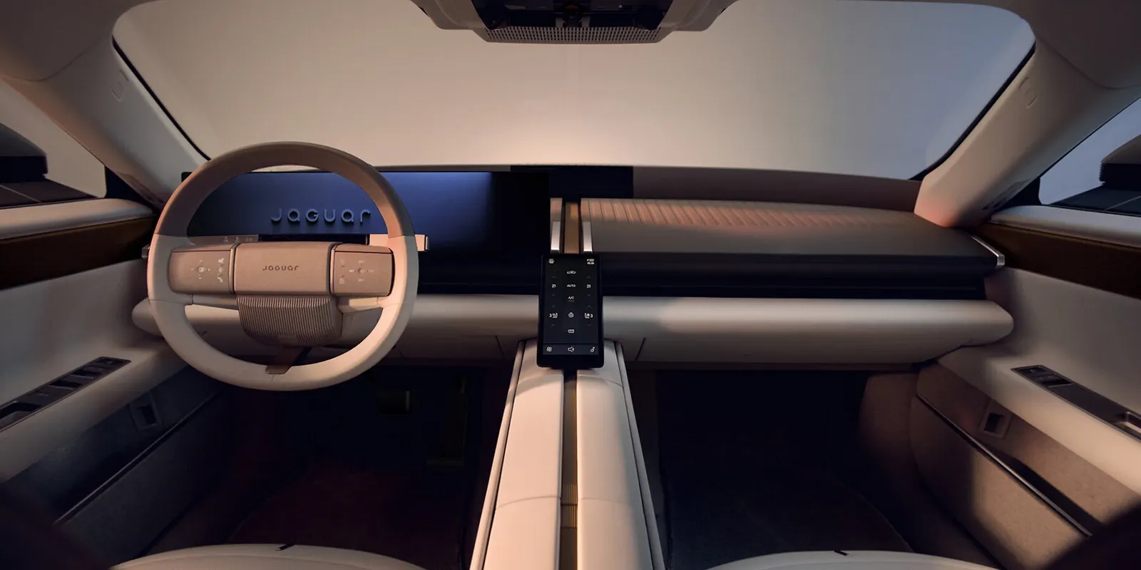 Jaguar показал интерьер Type 01 с продольным «шпинделем» и оттенками travertine