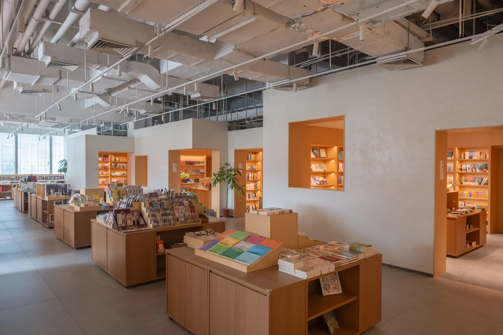 PAGEONE Bookstore at Wuxi Park Station / llLab