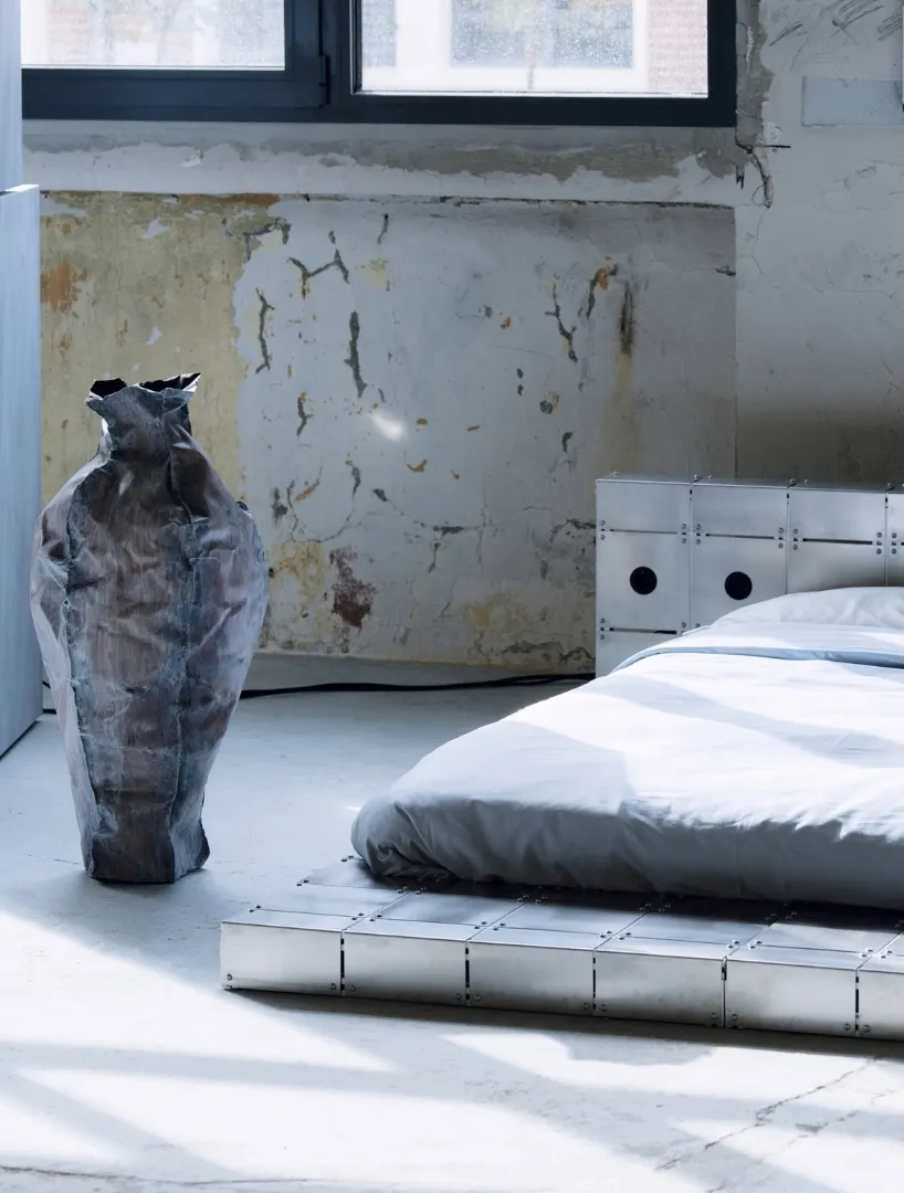 ALUMINUM AND BOLTED STEEL TURN PLATFORM BED INTO AN ARCHITECTURAL PIECE AT PARIS DESIGN WEEK