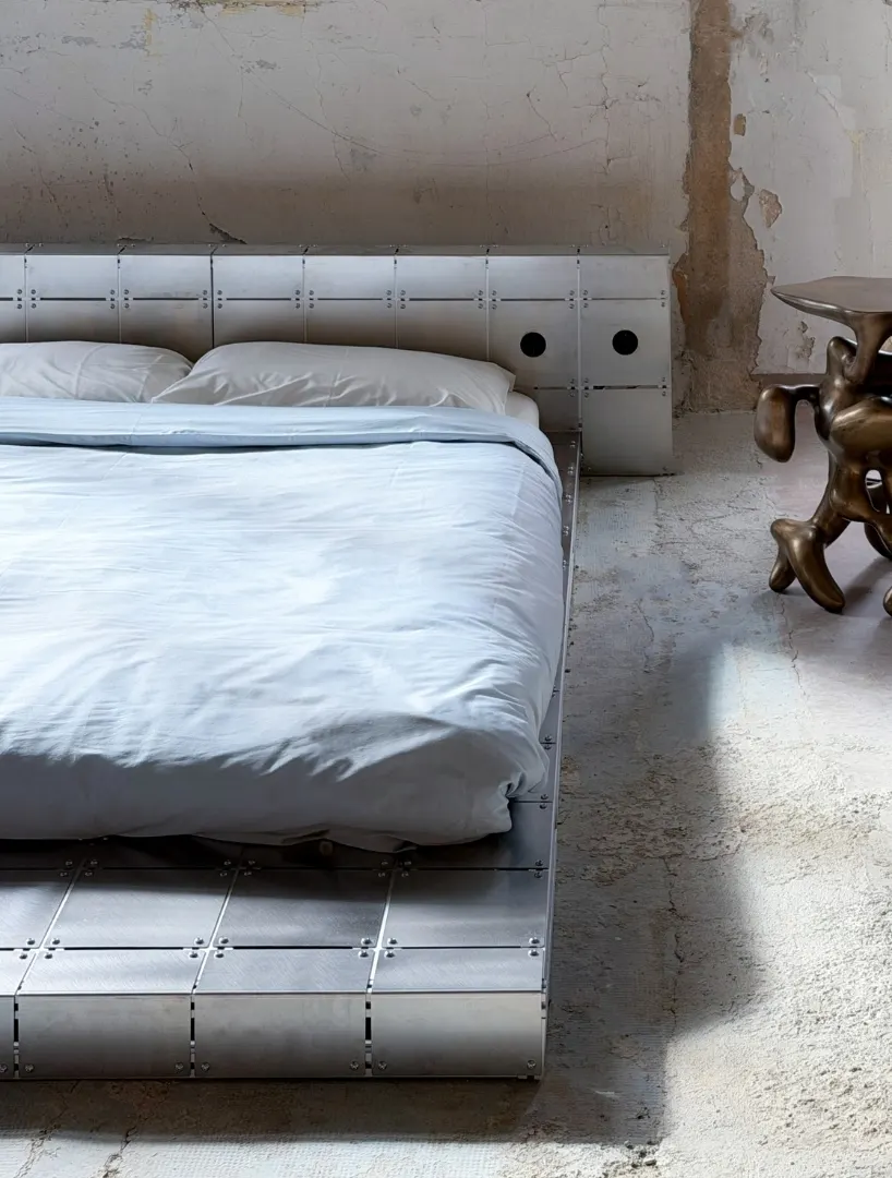 ALUMINUM AND BOLTED STEEL TURN PLATFORM BED INTO AN ARCHITECTURAL PIECE AT PARIS DESIGN WEEK