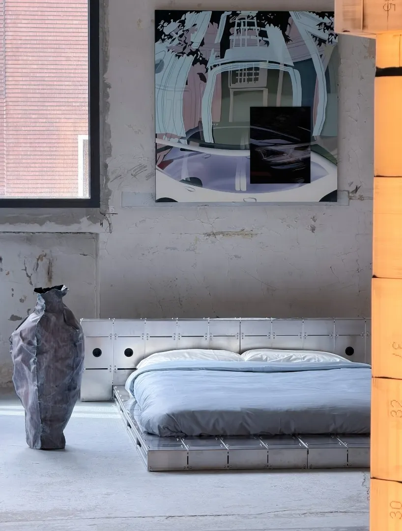 ALUMINUM AND BOLTED STEEL TURN PLATFORM BED INTO AN ARCHITECTURAL PIECE AT PARIS DESIGN WEEK