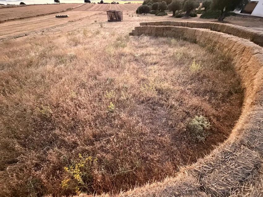 KURA: straw land art with amphitheater, experimental garden and walking path in rural Spain