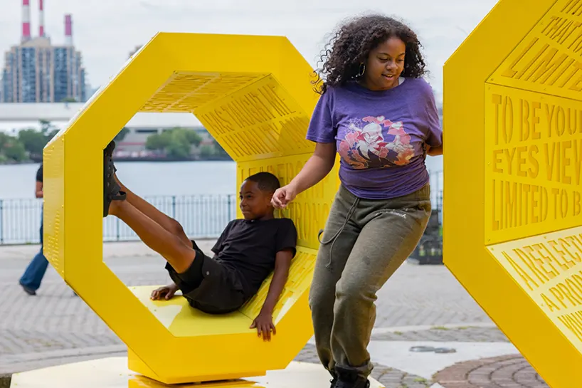 Rotating octagonal forms and community voices shape a Queens public landmark
