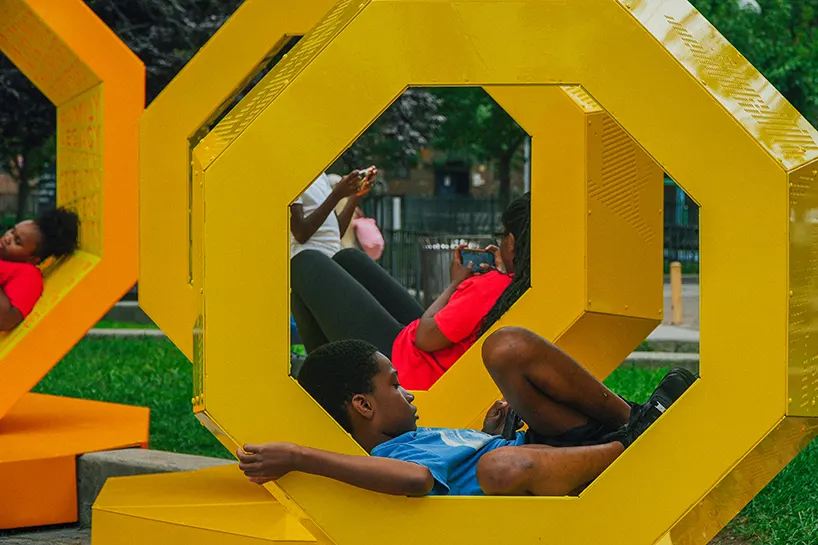 Rotating octagonal forms and community voices shape a Queens public landmark