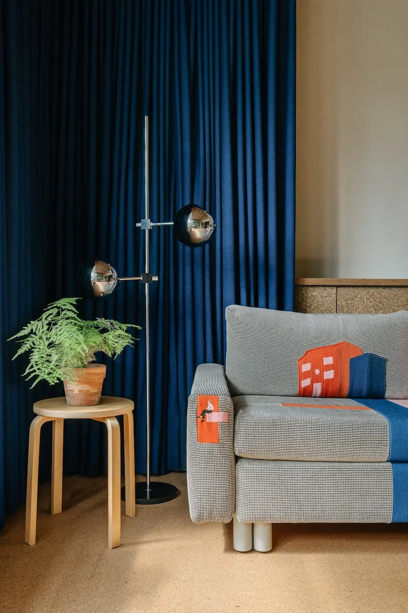 Stepped Timber Platforms and Operable Textiles Shape Circular Düsseldorf Home by Urselmann Interior
