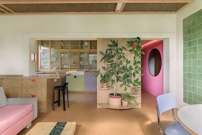 Stepped Timber Platforms and Operable Textiles Shape Circular Düsseldorf Home by Urselmann Interior