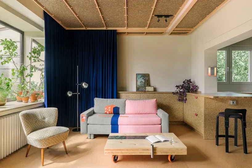 Stepped Timber Platforms and Operable Textiles Shape Circular Düsseldorf Home by Urselmann Interior